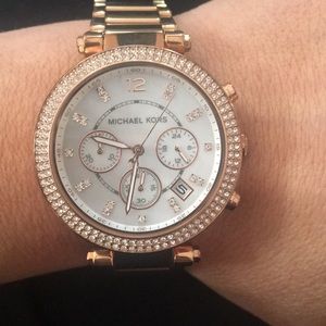 Michael Kors rose tone watch.
